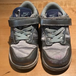 Silver Nike sneakers with lavender swoosh